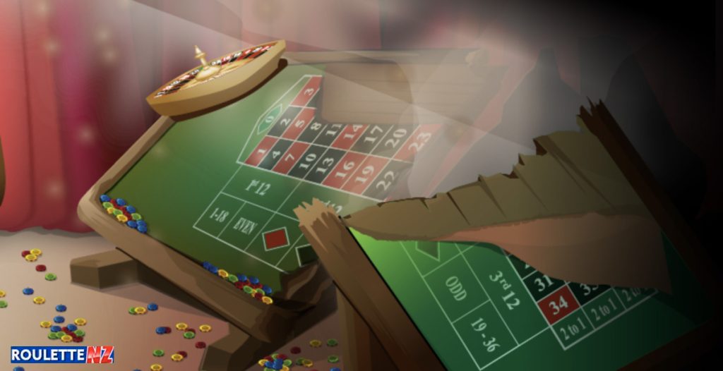 A person's hand placing a bet on a roulette table, symbolizing the application of the Andrucci strategy in roulette gameplay